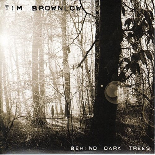 Behind Dark Trees